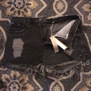 Distressed black denim shorts